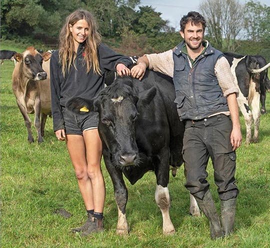 Sophie and Tom with cows