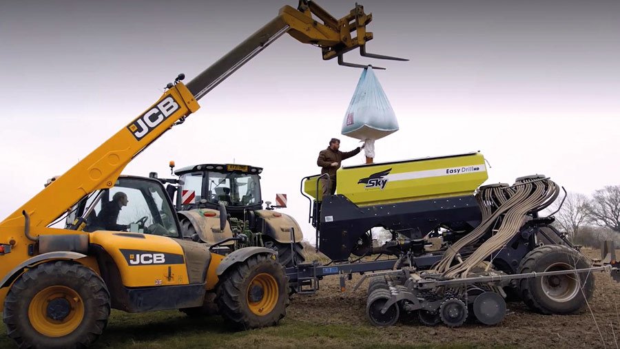 Seed being lifted into drill on George Halsall's farm