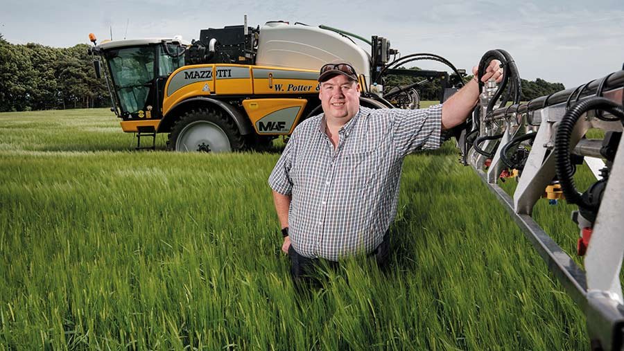 Man leaning on his sprayer