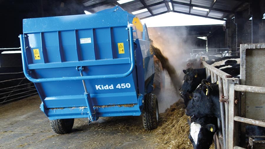 Bale chopper feeding cows