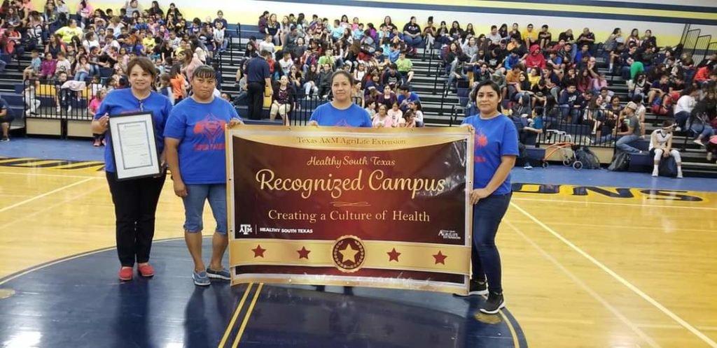 Group holding Healthy South Texas Recognized School display banner 