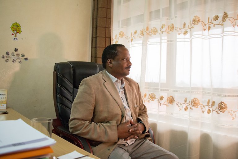 Daniel Kobei, executive director of the Ogiek Peoples’ Development Program, poses for a portrait in the OPDP office in Nakuru, Kenya. Image by Nathan Siegel for Mongabay.