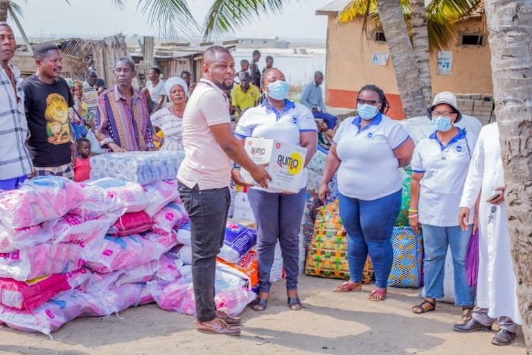 Donations being disbursed to the victims of coastal erosion victims. Image by Sylvester Kumawu.