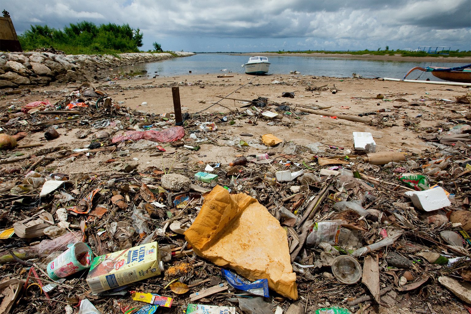 A beach in Bali littered with plastic and other waste. 