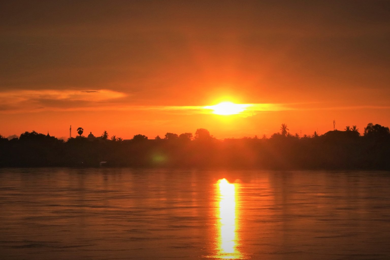 The sun sets over the Mekong in Nong Khai, Laos.