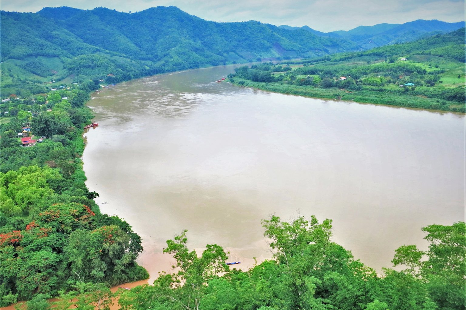 View of Mekong upriver towards Sanakham dam site behind hill on the right.