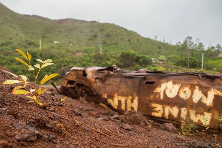 A burnt out car which was torched in protest during the controversial attempted sale of the Goro mine. Prony Resources, with shares majority owned by New Caledonian stakeholders, now manages Goro. Image courtesy of Lachie Carracher.