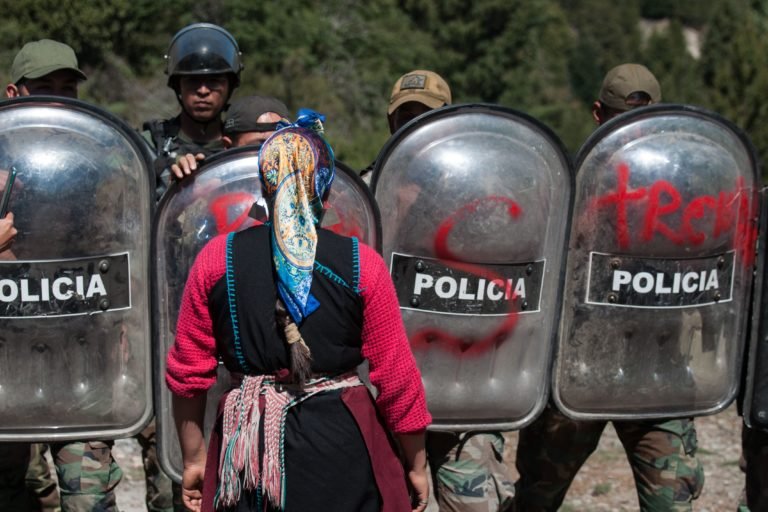 A 14-year-old member of Lof Quemquemtrew confronts police after they fired rubber bullets at mourners. Image courtesy of Denali DeGraf.