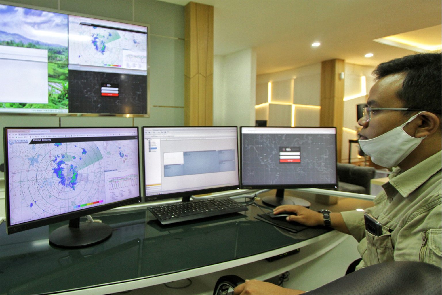Shandy monitors Citarum data on a row of computer screens