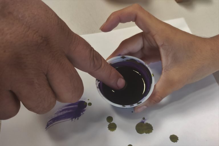 After casting their ballots in a municipal referendum on mining in Asunción Mita, residents dip an index finger in purple ink.