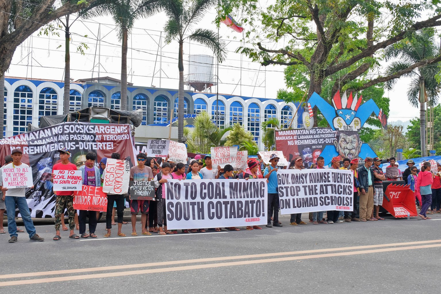 Activists and Indigenous peoples holding a protest.