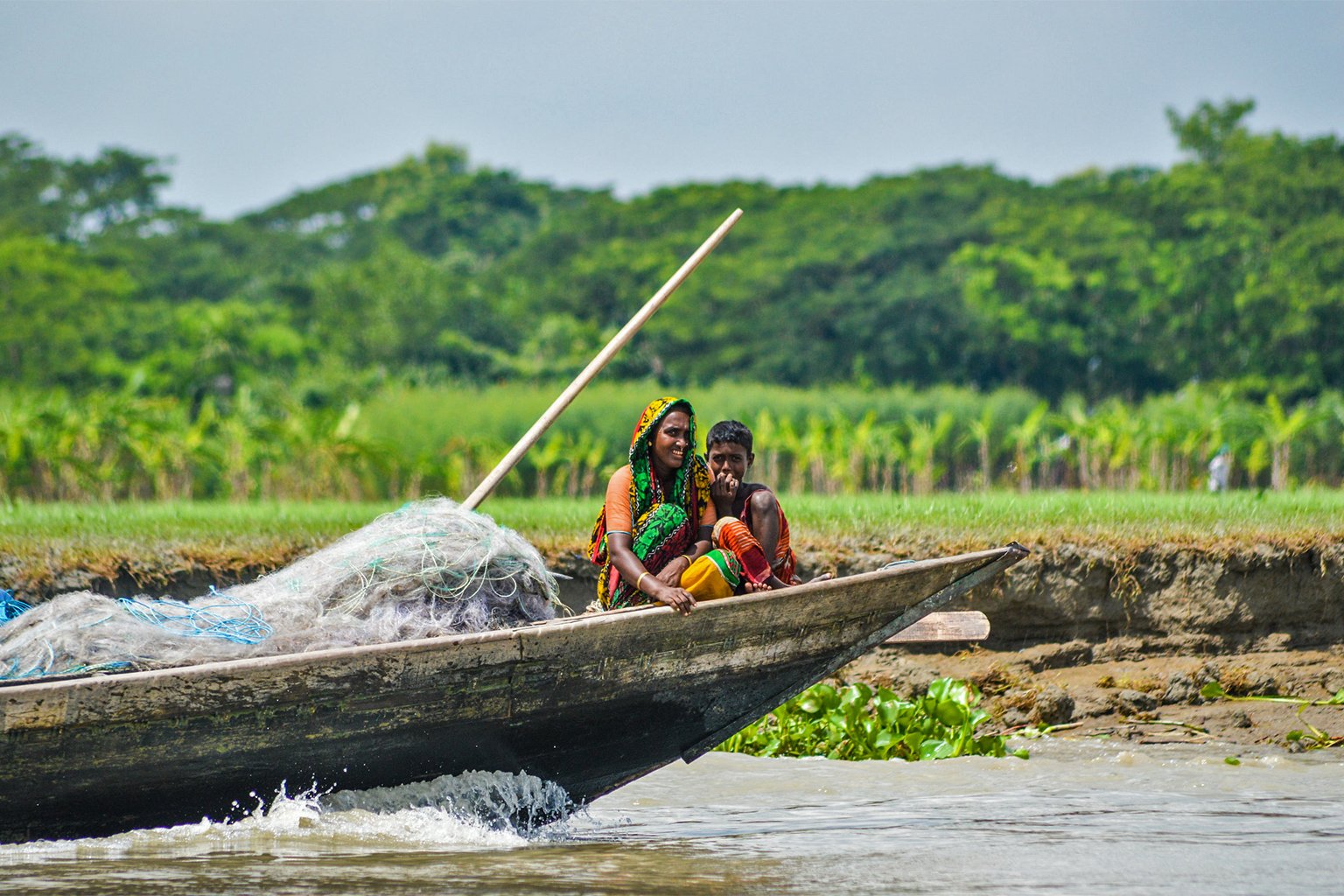 Woman and child in a fishing boat.