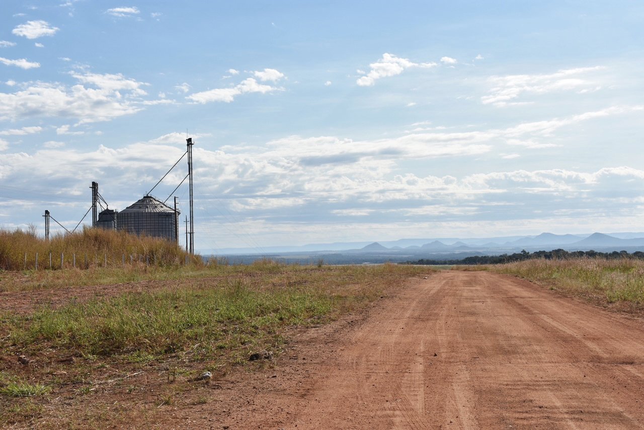 A grain silo stands out against the background of the Brazilian Cerrado.
